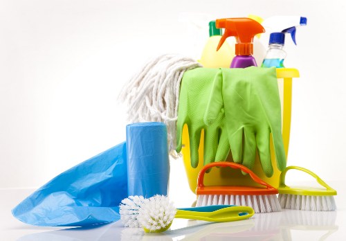 Local upholstery cleaner treating a sofa in Watford
